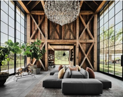 Ashton Kutcher and Mila Kunis' barn-inspired living room with floor to ceiling industrial windows